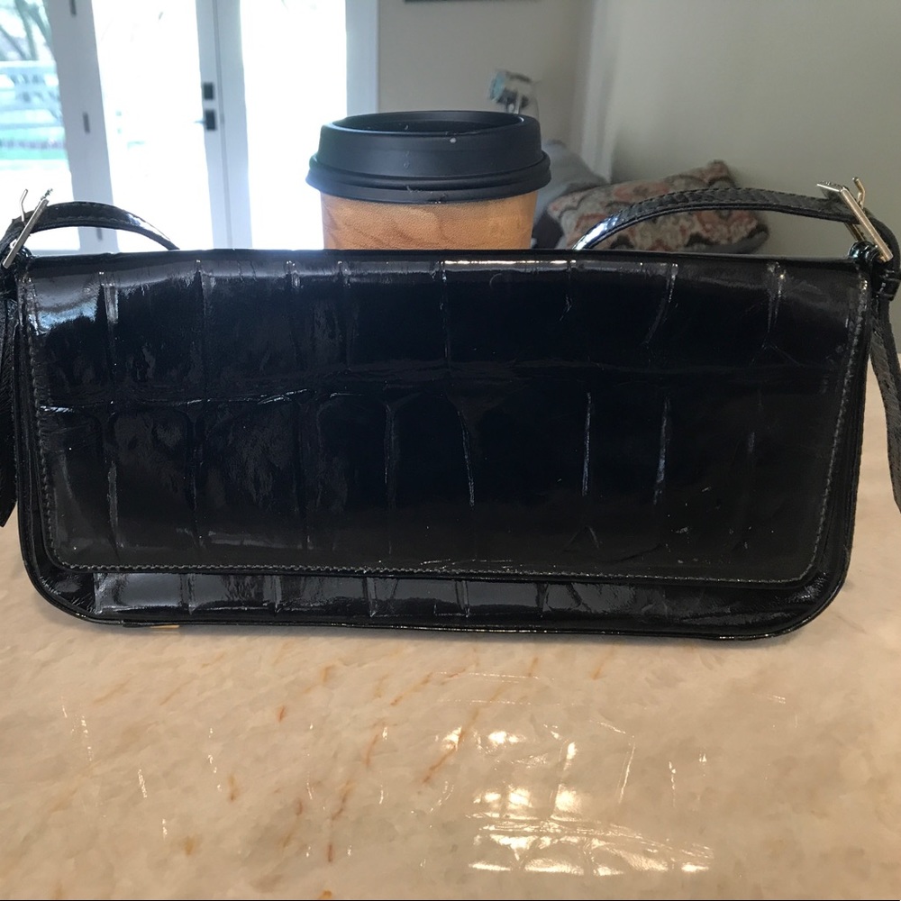 Escada patten leather clutch.